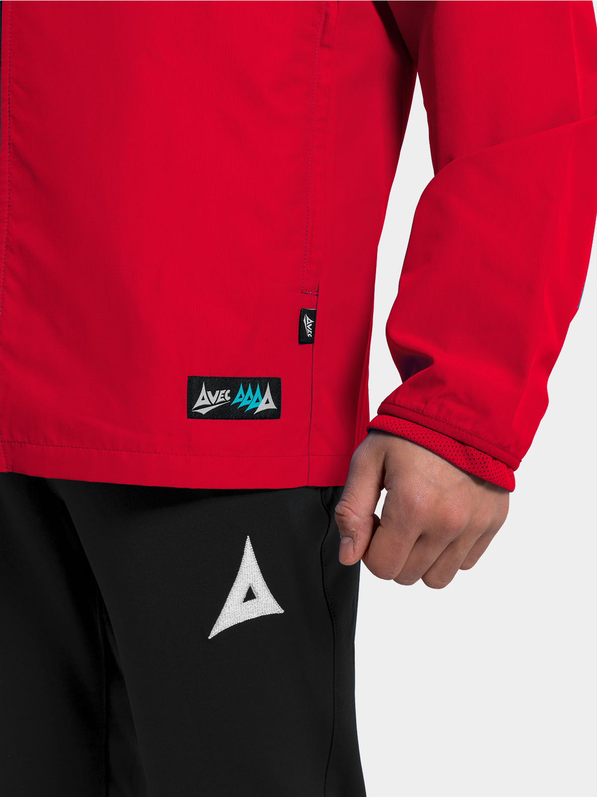 	view of the zipped side pockets on the red focus 2 jacket, keeping valuables safe on the touchline