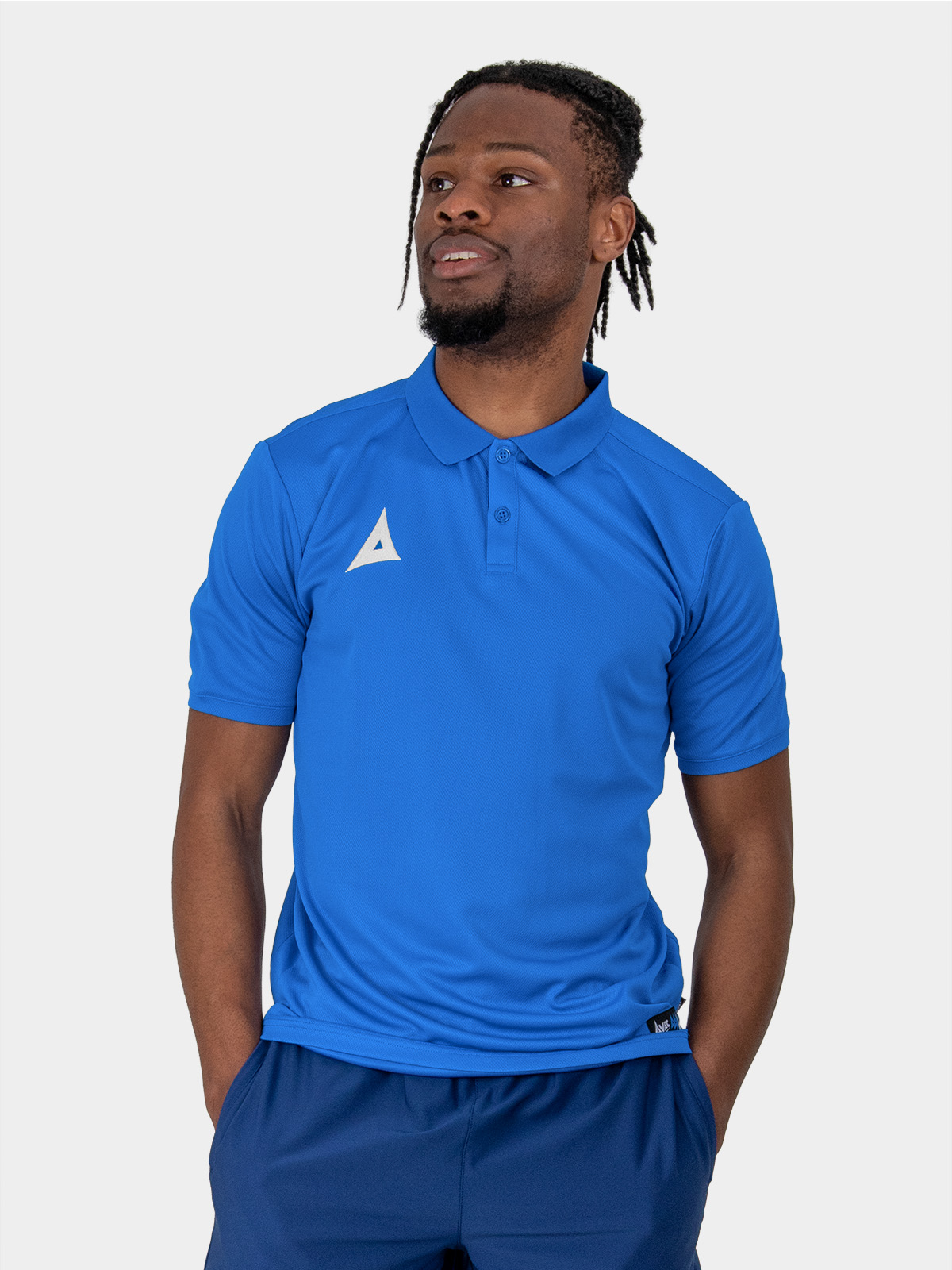 a male model wearing the avec focus 2 royal blue tech polo, plain blue button up top