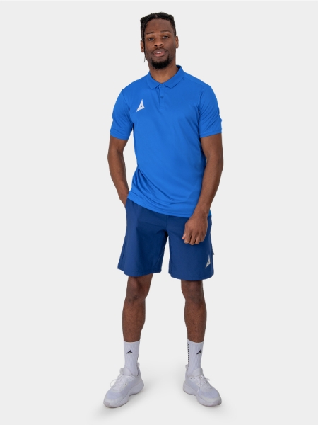 	A Male Model is stood wearing the Avec Focus 2 Royal Tech Polo, Plain Royal blue top and the Avec Focus 2 Navy Track Pant