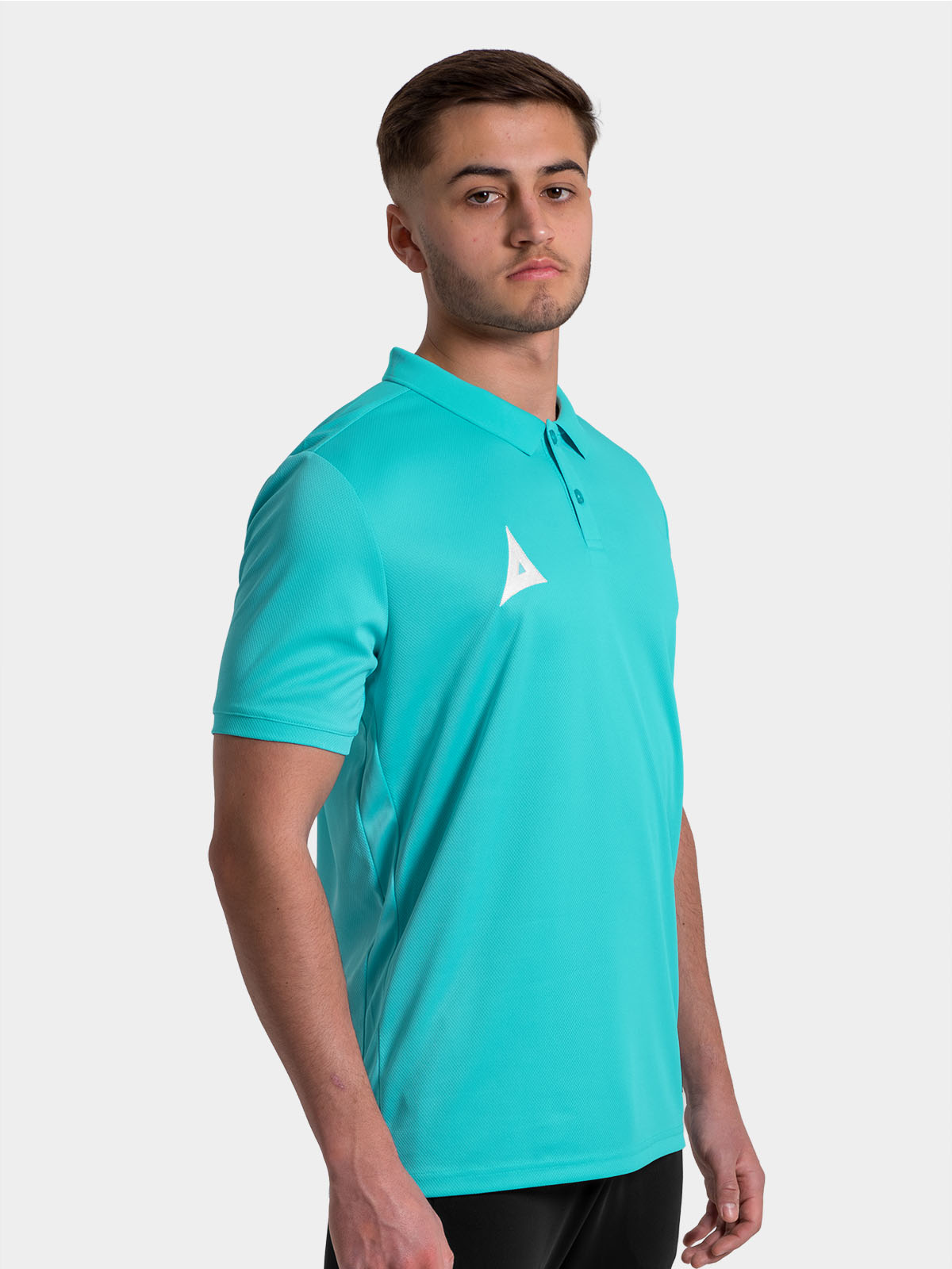 	athlete wearing the navy focus 2 tech polo, showcasing the refined flat-knit collar and soft-feel neck taping.