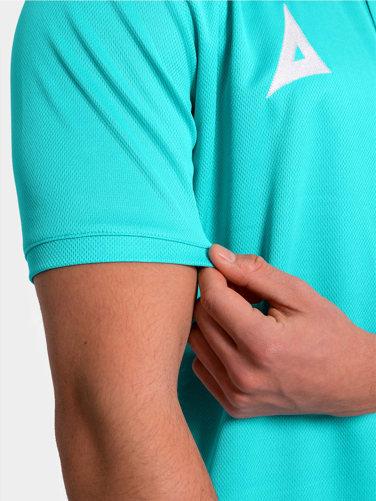 	close-up shot of the two-button placket and flat-knit neckline on the navy focus 2 tech polo.