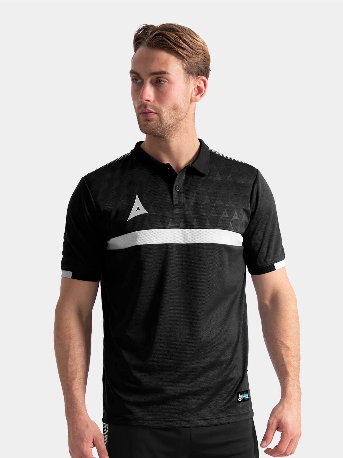 	coach wearing the black evolve pro tech polo, demonstrating a professional sideline appearance.