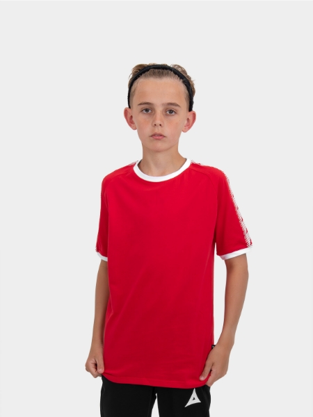 	A boy is stood wearing wearing the Avec Evolve Red T-Shirt, plain red top with sleeve detail