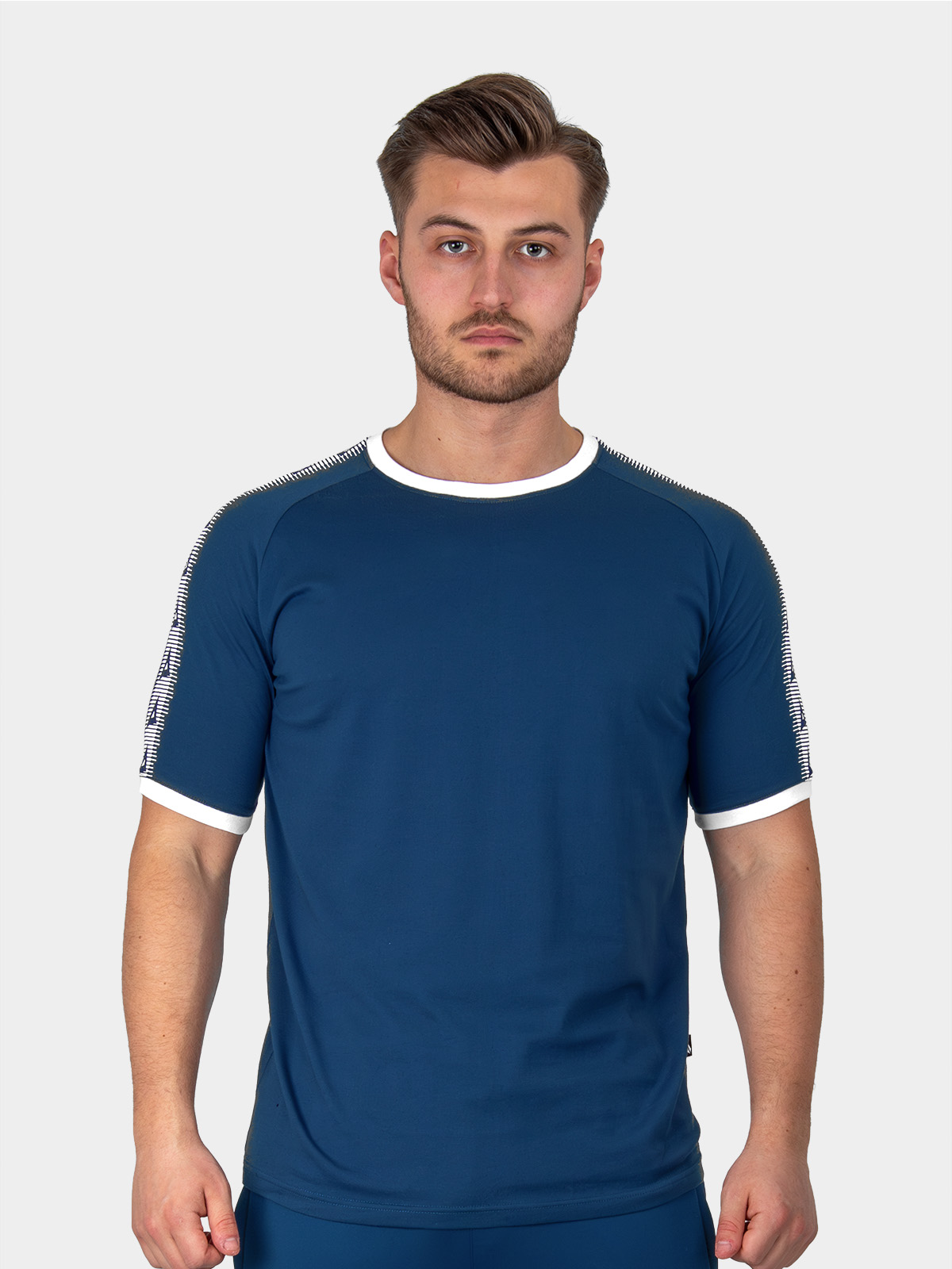 	a male model wearing the avec evolve navy t-shirt, plain navy graphic tee