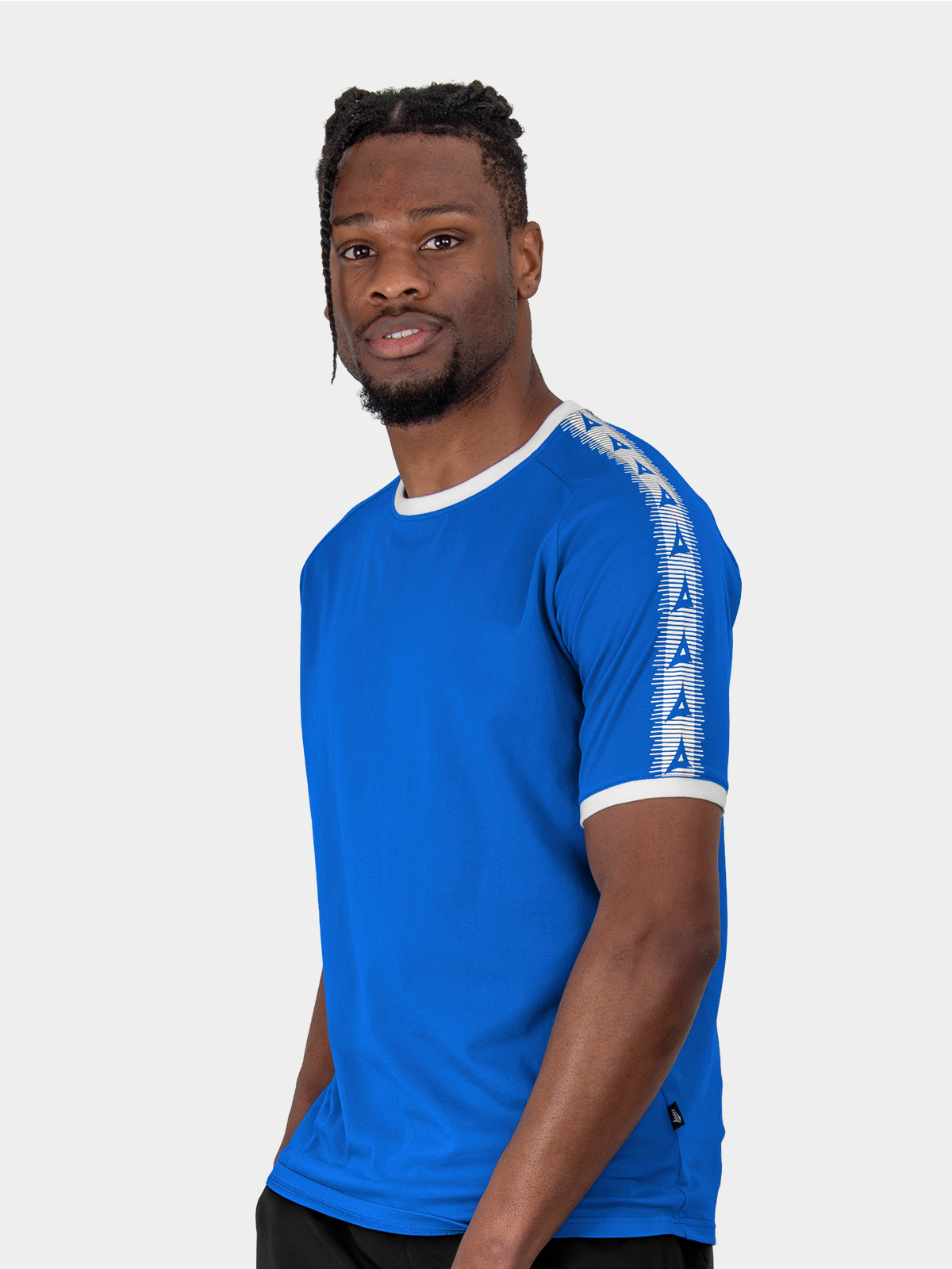 a male model wearing the avec evolve royal blue t-shirt, plain blue top with ribbed sleeve cuff and neck