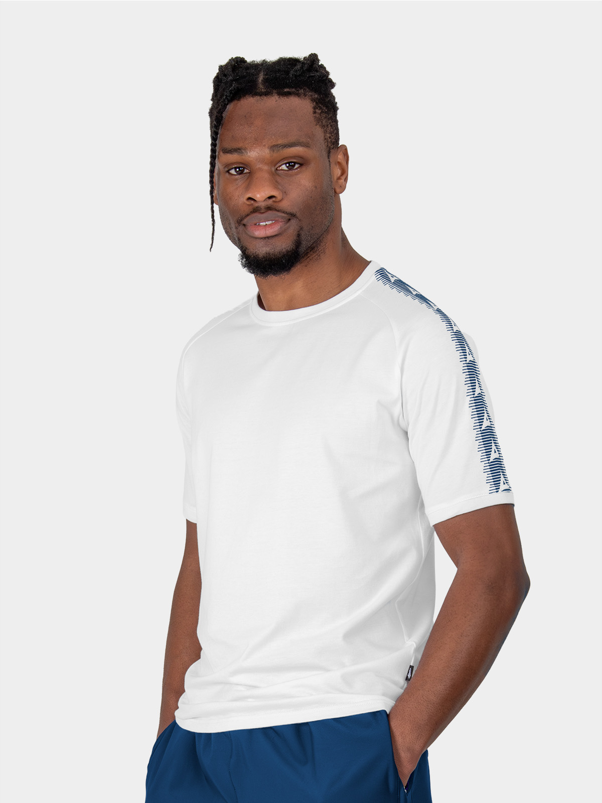 	a male model wearing the avec evolve white t-shirt, plain cotton top with ribbed sleeve cuff and neck
