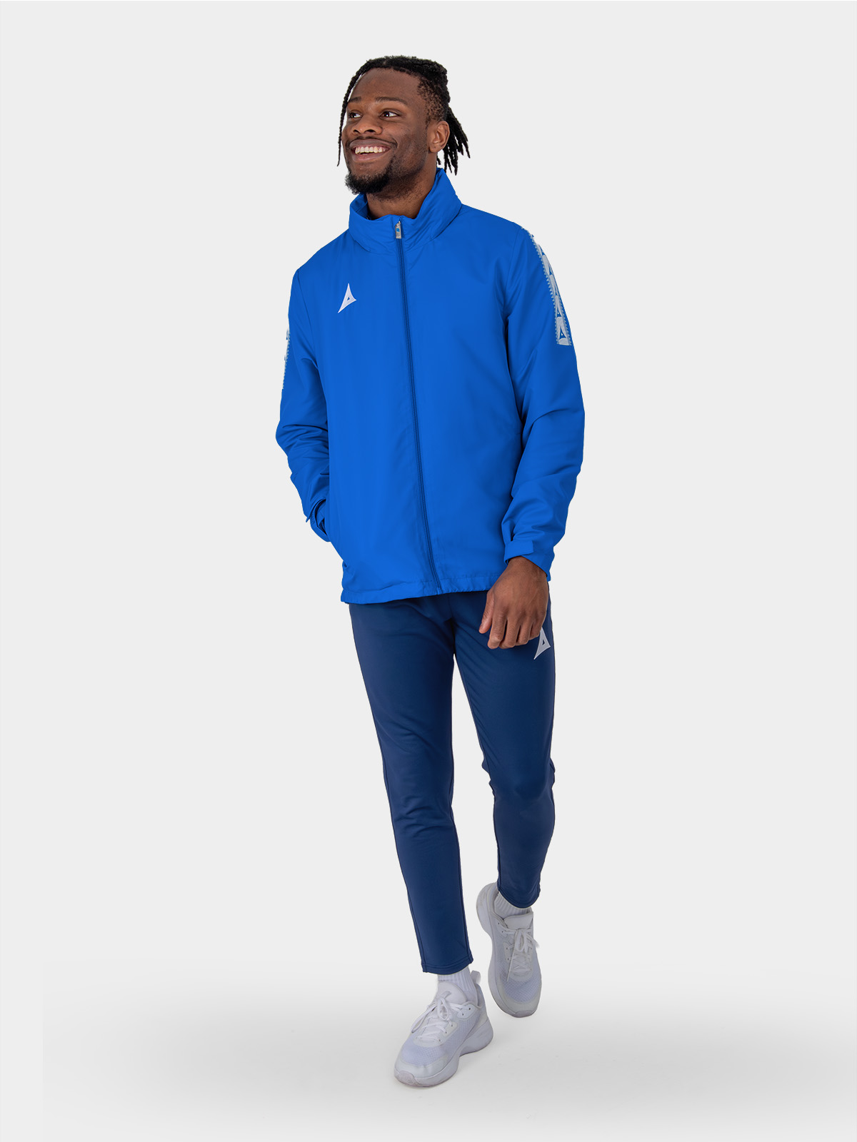 adult wearing royal blue evolve football rain jacket - coordinates with royal blue club kit