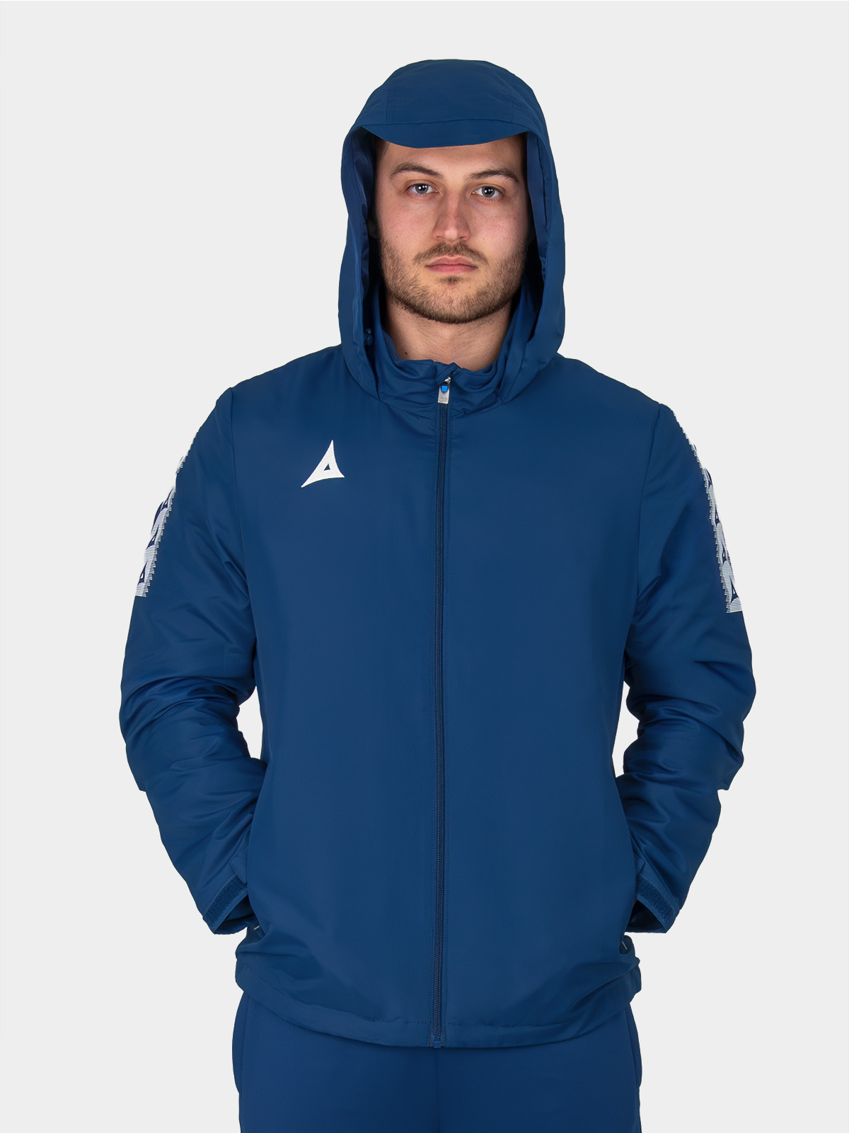 adult model wearing navy evolve football rain jacket - lightweight water-resistant shell