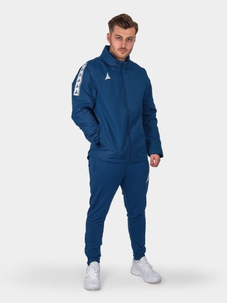 	Full body adult shot in navy Evolve Rain Jacket with adjustable hood up for wet weather protection