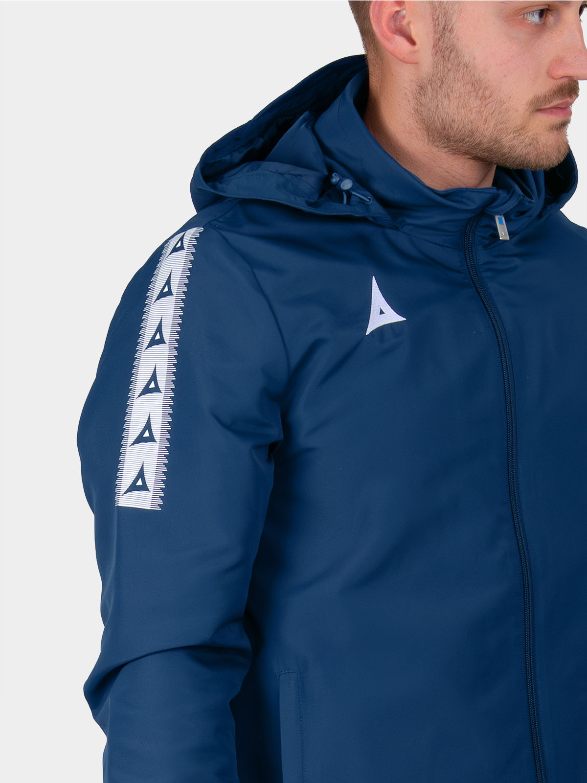 	close-up of heritage a contrast sleeve taping and velcro cuff tab on navy evolve rain jacket