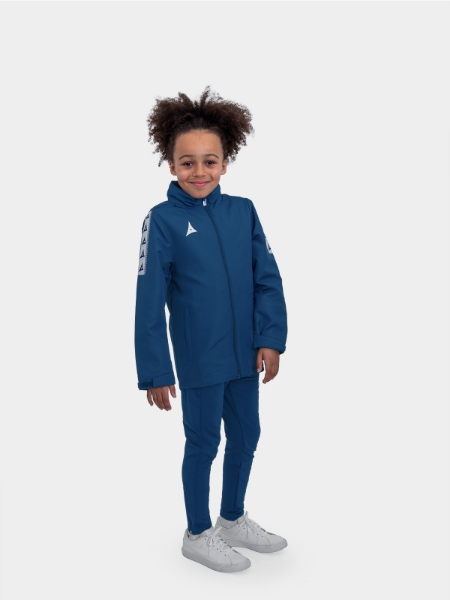 	Full body shot of junior in navy football rain jacket showing professional fit across junior sizing
