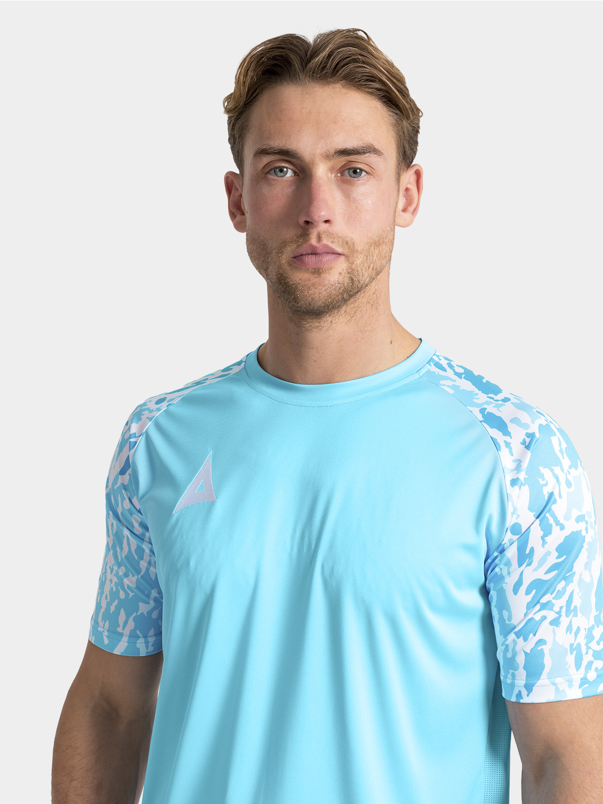 	detailed shot of the durable ribbed round collar and internal neck branding on the hyper sky jersey.