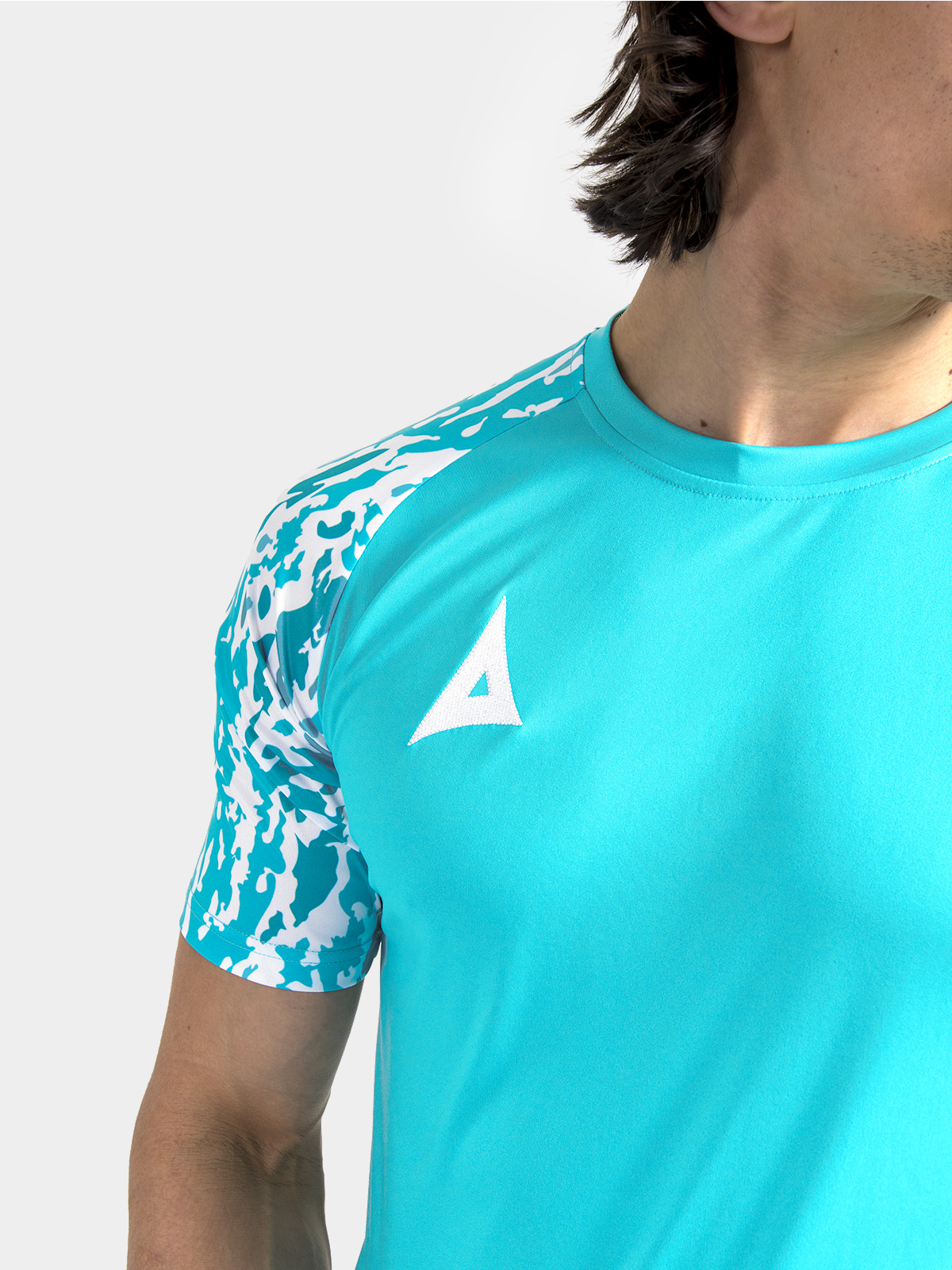 	technical shot of the reinforced round neckline and soft-feel interior label on the hyper blue jersey.
