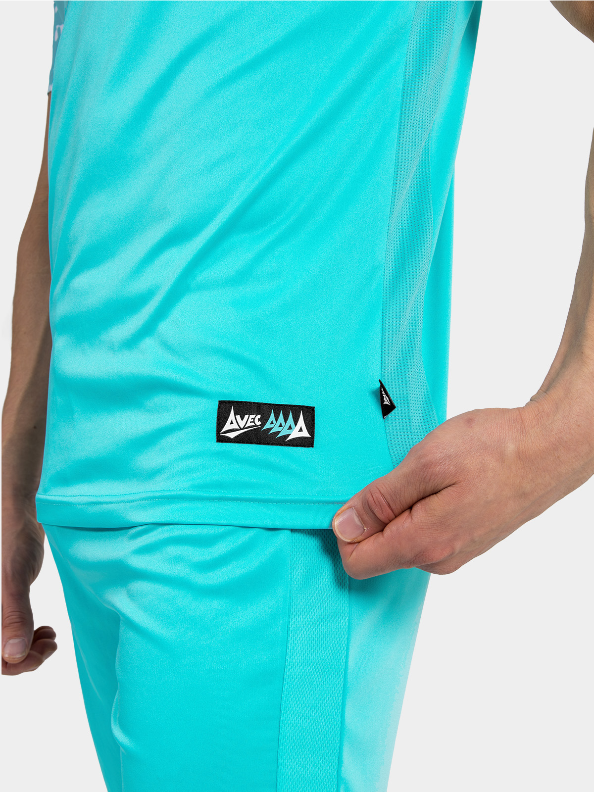 	side seam detail of the hyper blue jersey, showing the high-performance mesh inserts and woven authentic id label.