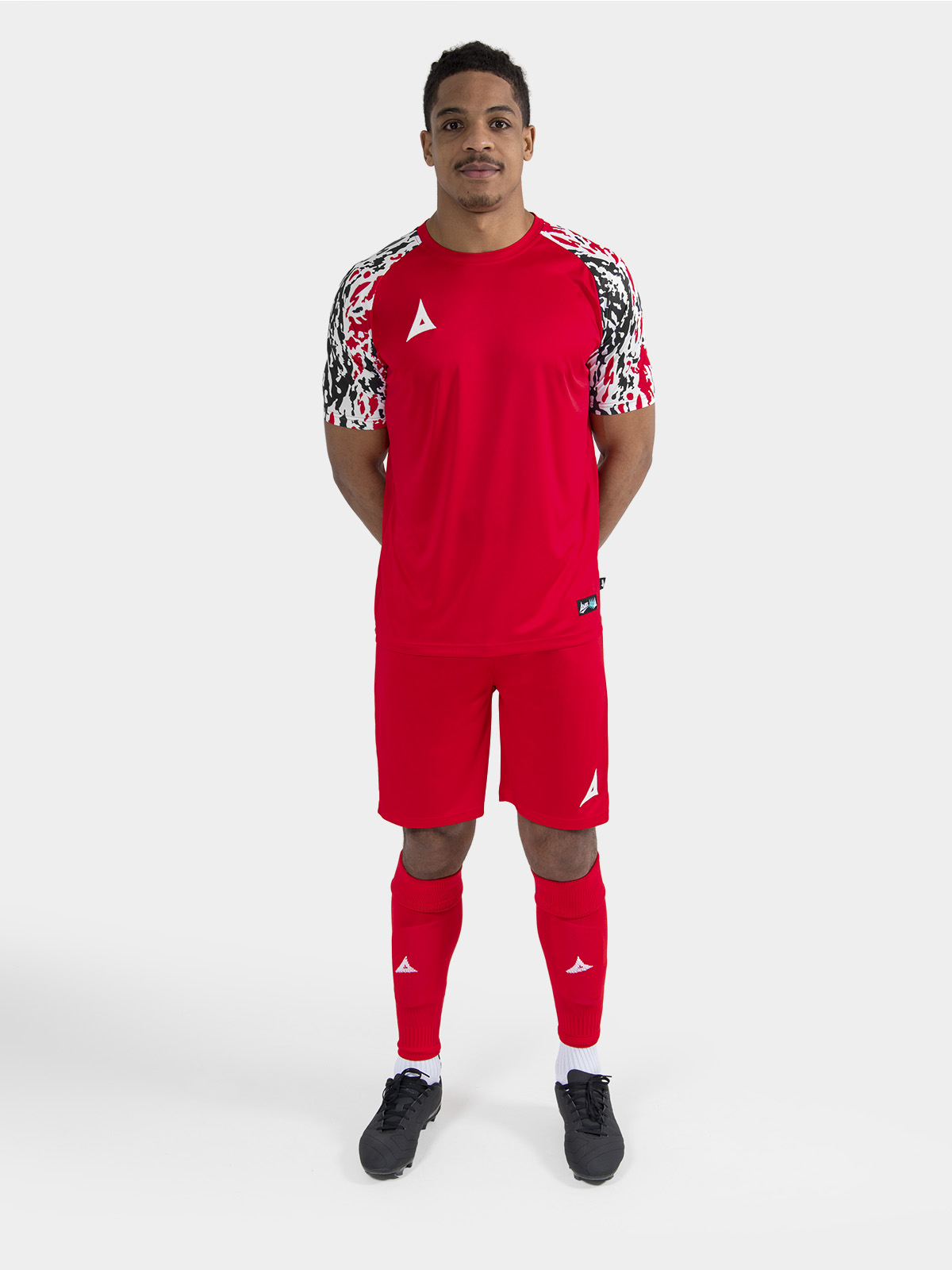 full body kit view of the red classic pro jersey on-model, demonstrating a unified professional appearance.