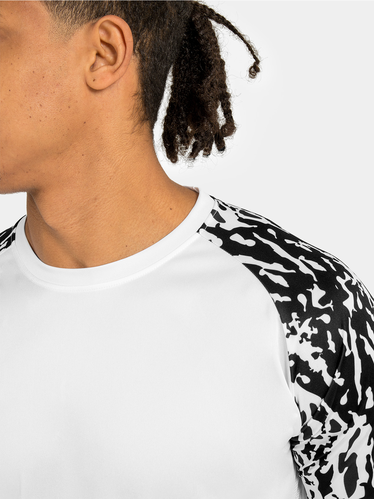 	macro view of the black sublimated camo design, adding a technical and modern edge to the sleeves.