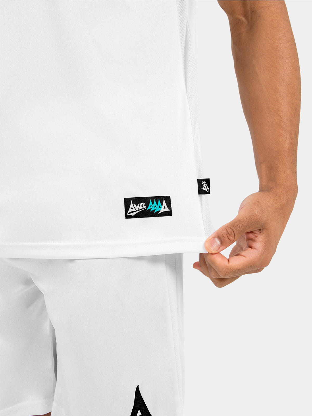 	lower hem detail of the white and black jersey, featuring the breathable mesh ventilation and official woven authenticity label.
