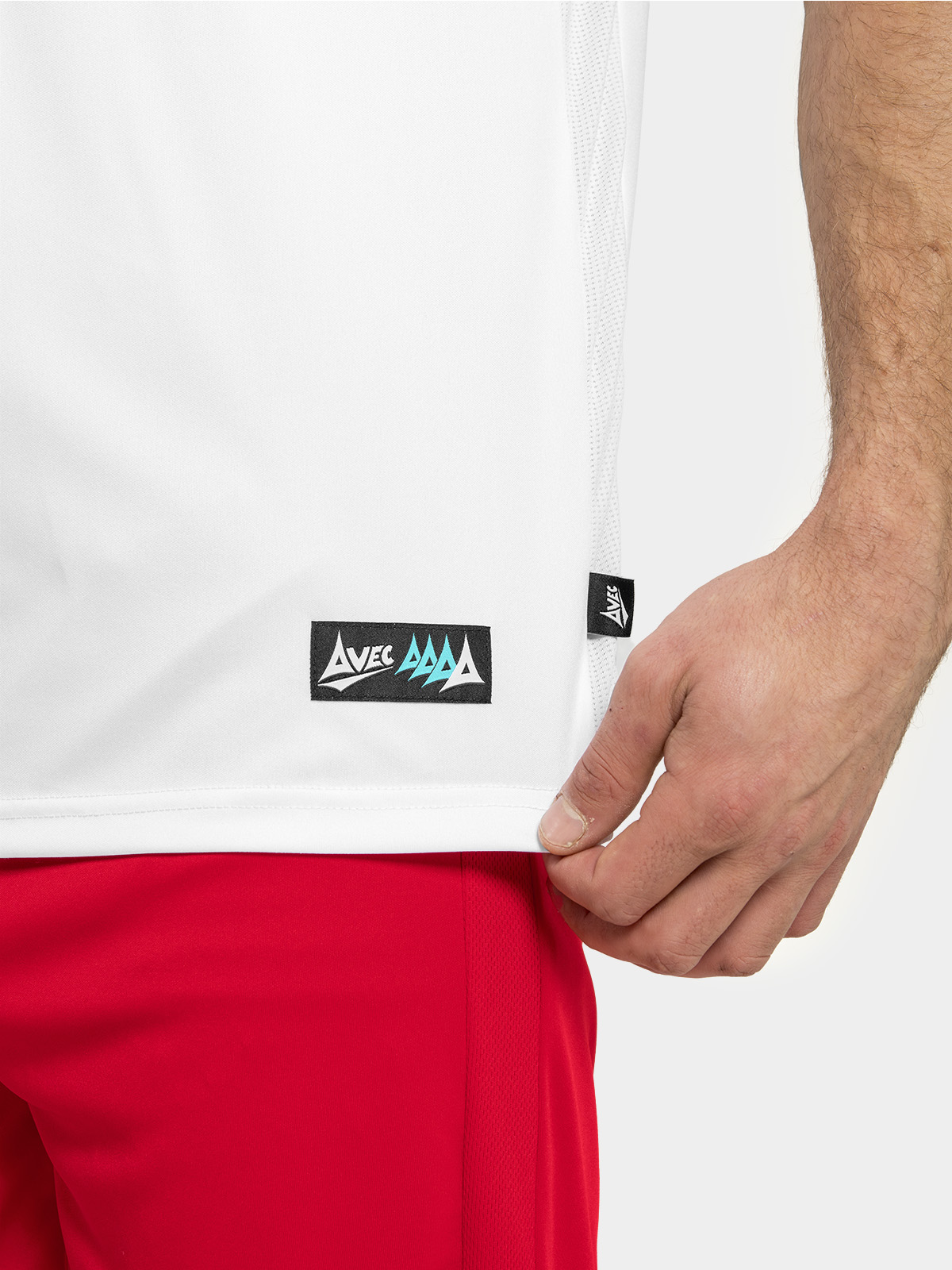 	technical close-up of the red mesh ventilation panel and the official woven authentic id label at the hem.