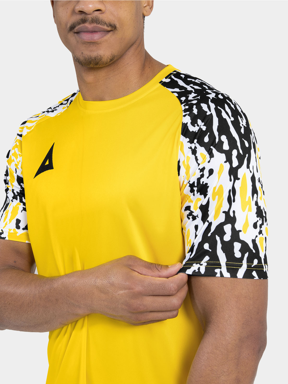 	close-up of the tonal yellow sublimated camo detail, providing a high-end finish to the sleeves.