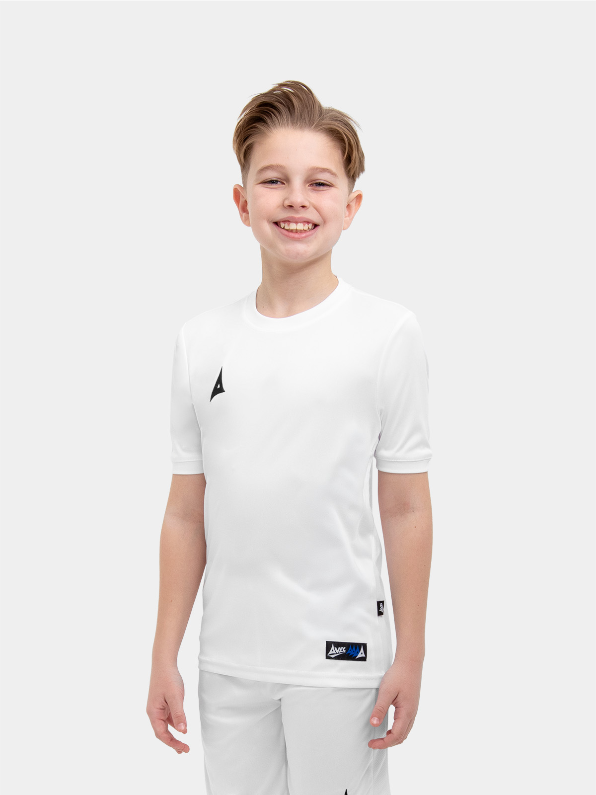 	the child in the shoot is wearing a full white kit