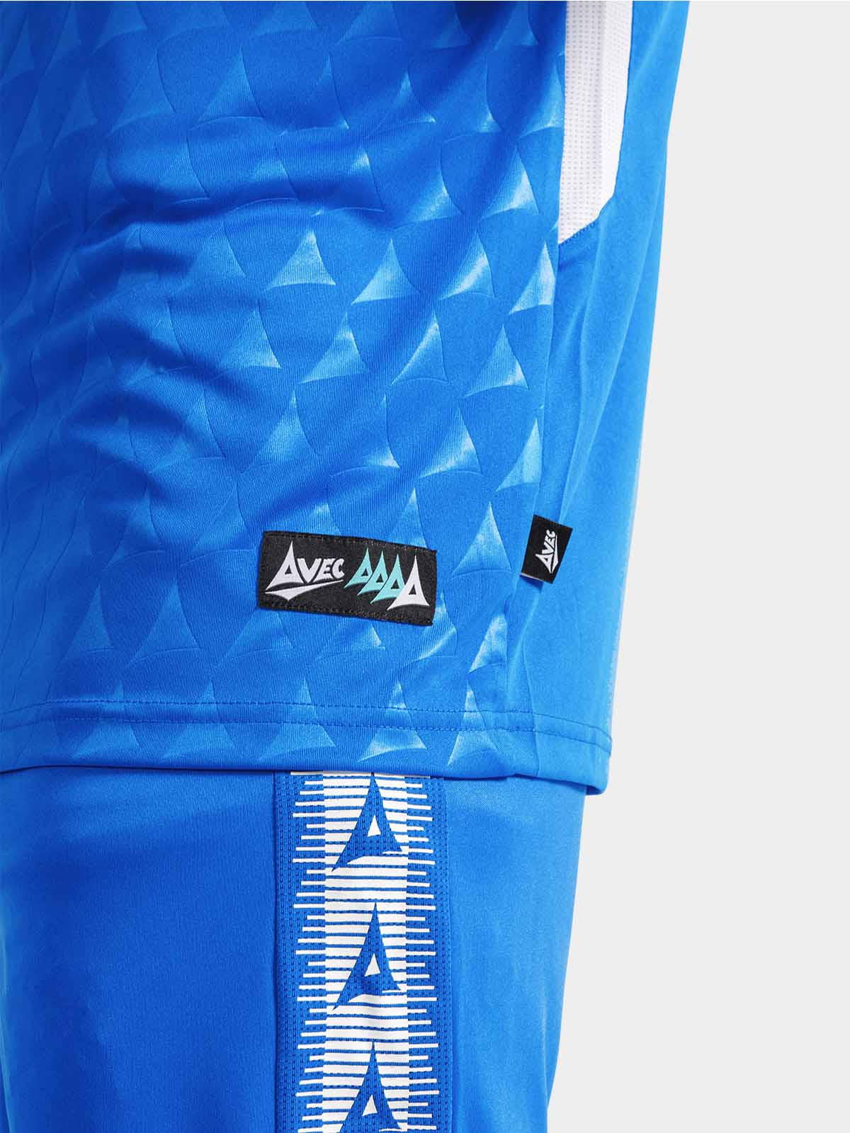 	detailed shot of the royal blue jersey hem, authentic id label, and breathable mesh inserts.