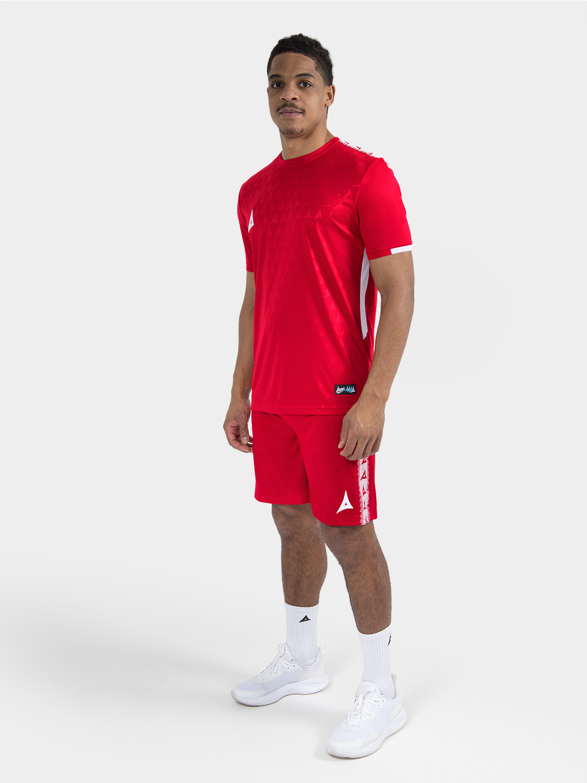 	full training kit combination in red on-model, demonstrating the elite club appearance.