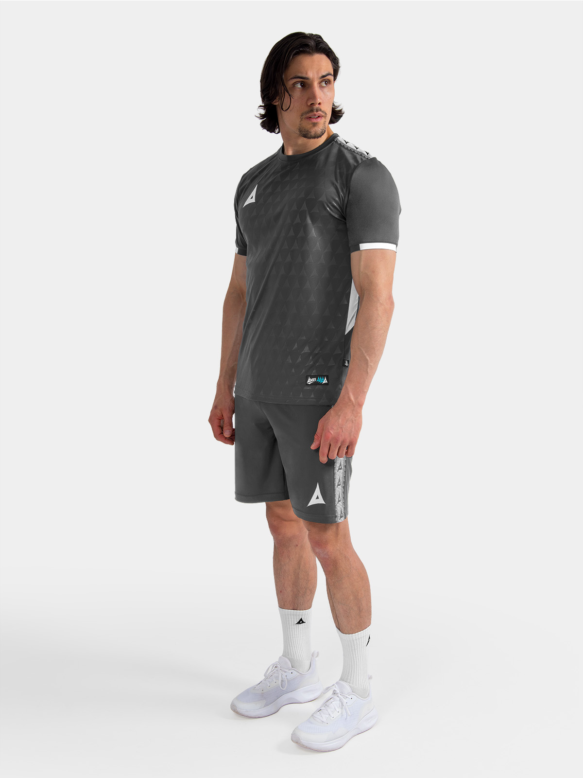	full-length view of the anthracite training kit on-model, demonstrating the professional training range