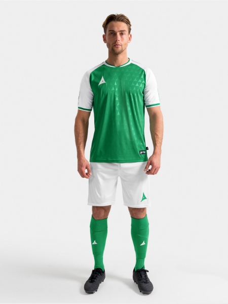 	Full body lifestyle view of the Green and White Heritage matchday kit.