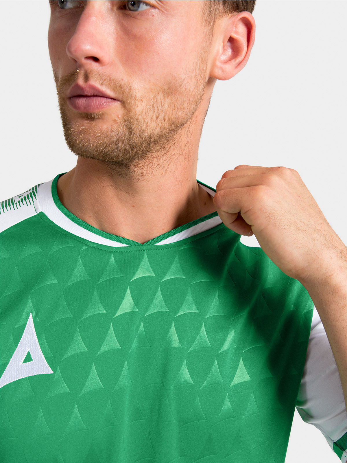 	neckline construction of the green and white heritage jersey featuring the soft-feel ribbed collar.