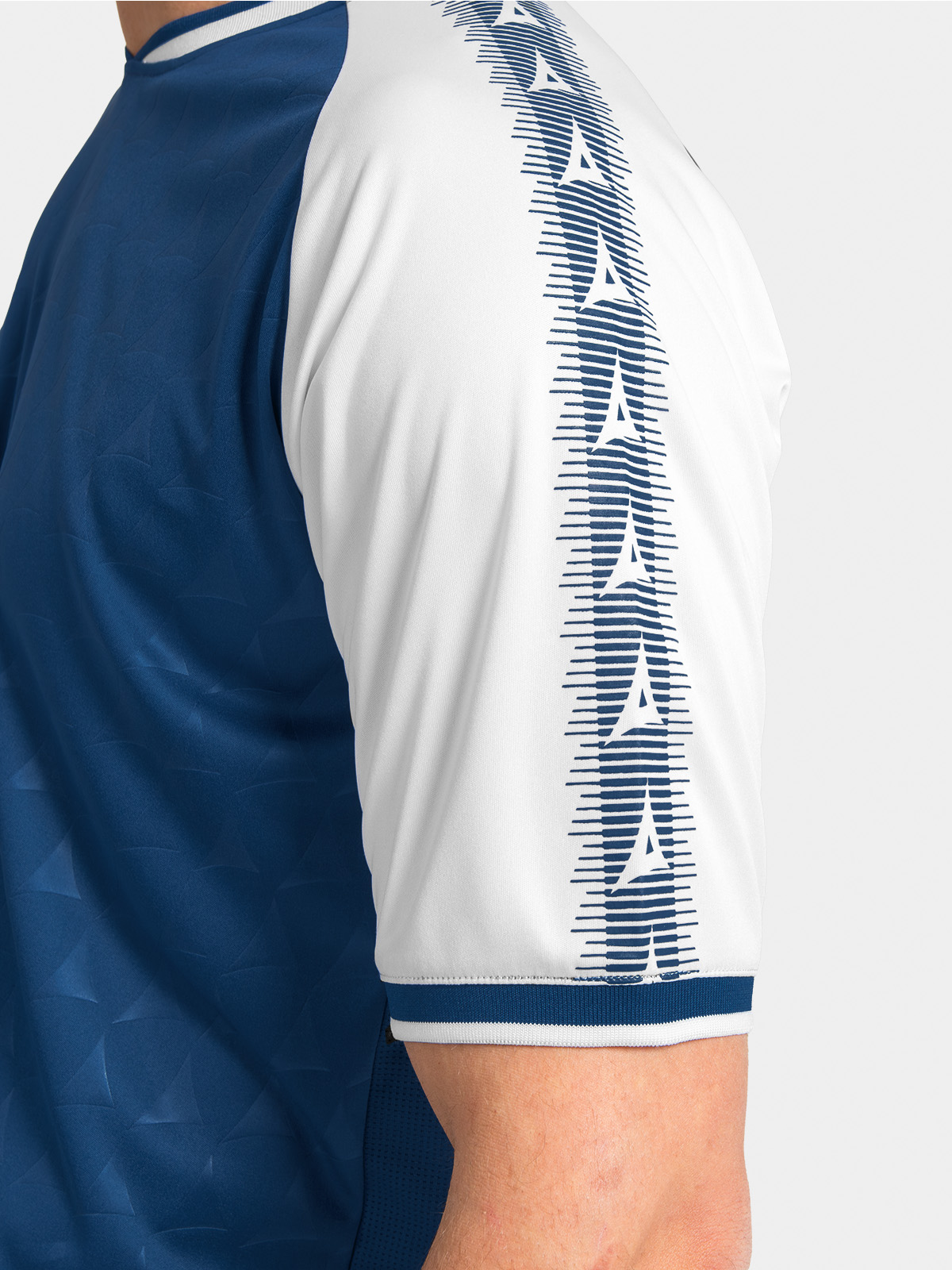 	close-up of the navy heritage sleeve with repeating white brand patterns.