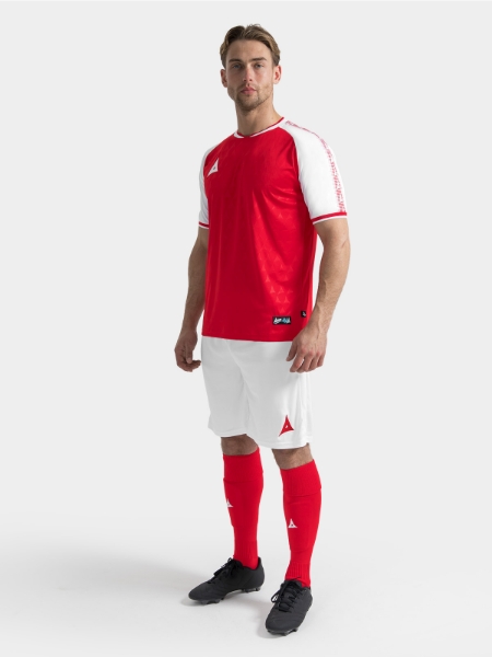 	Full body kit shot of the Red and White Heritage Jersey with white shorts and red socks.