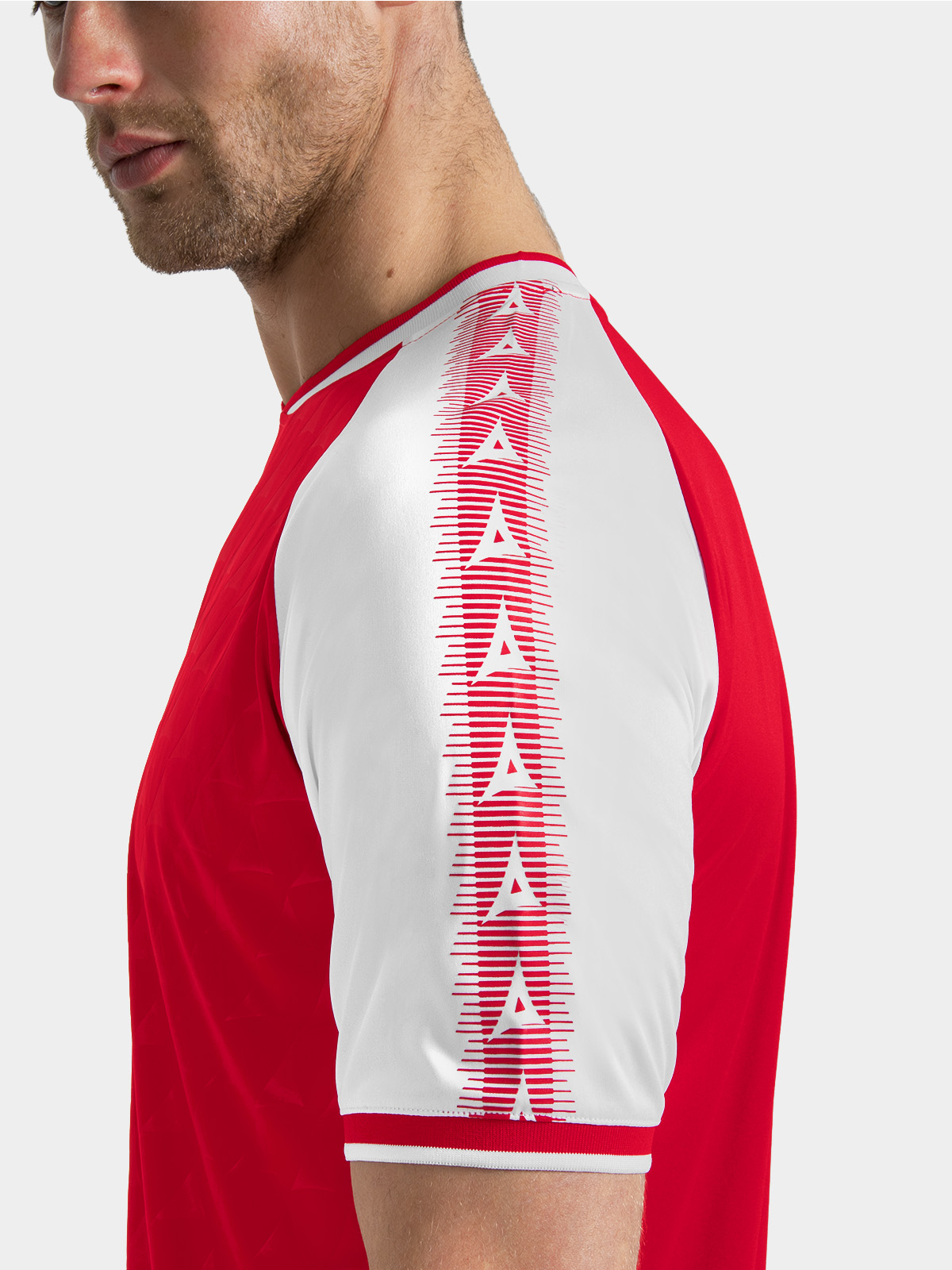 	red and white heritage jersey sleeve detail featuring the debossed 'a' logo.