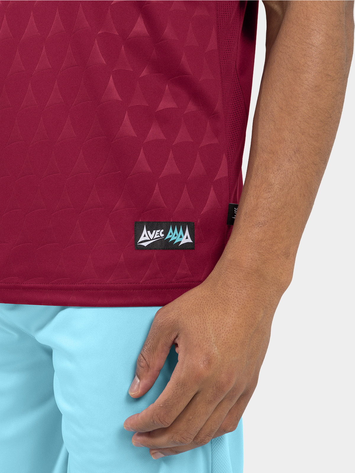 	authentic hem label and mesh ventilation on the claret heritage matchday shirt.