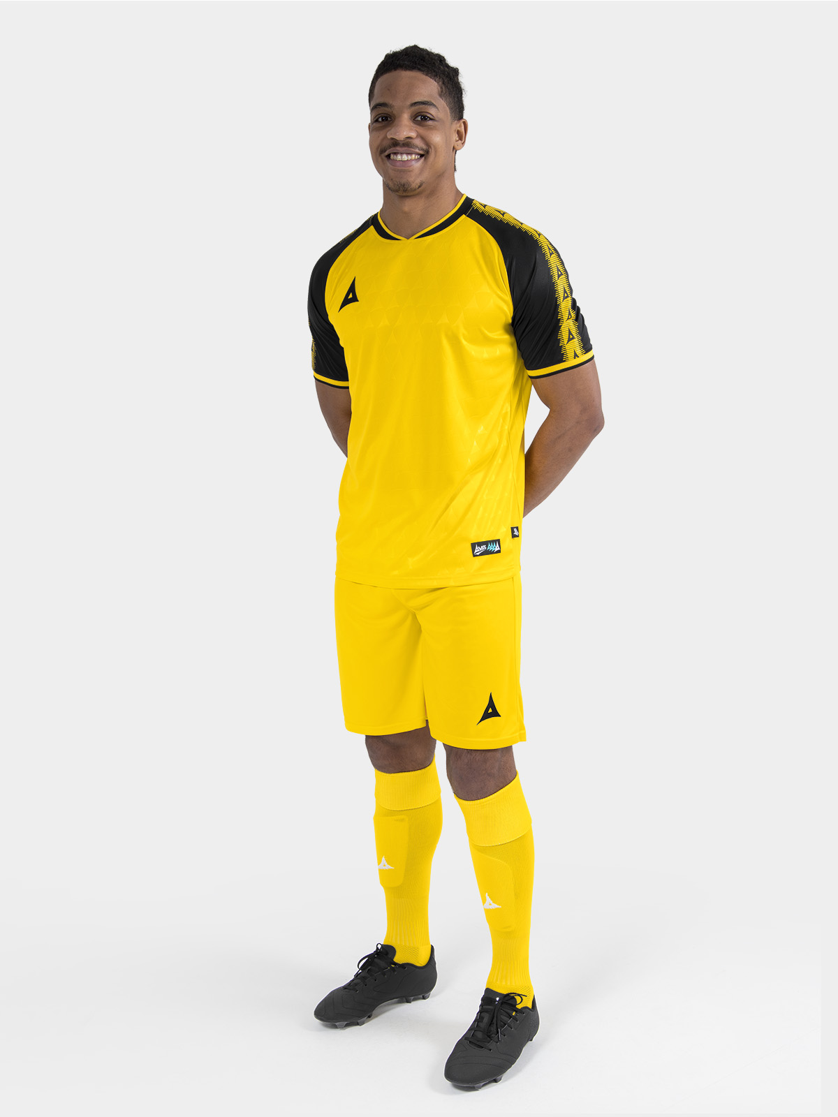 	full body view of the yellow and black heritage matchday kit with matching shorts and socks.