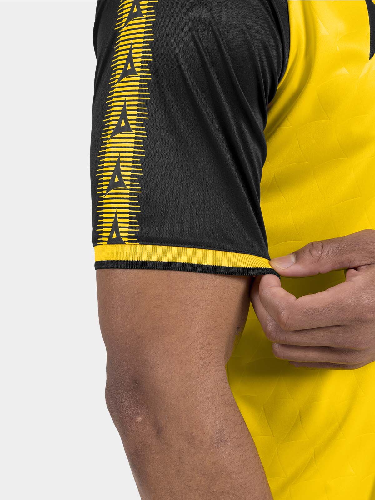 	close-up of the yellow heritage sleeve featuring the iconic repeating avec 'a' branding.