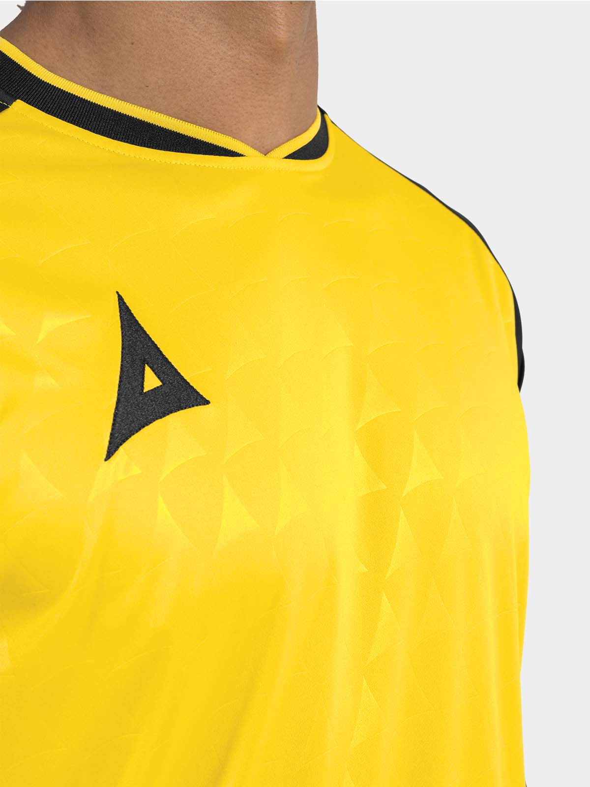 	detail shot of the yellow and black heritage jersey neckline and soft-feel v-neck collar.