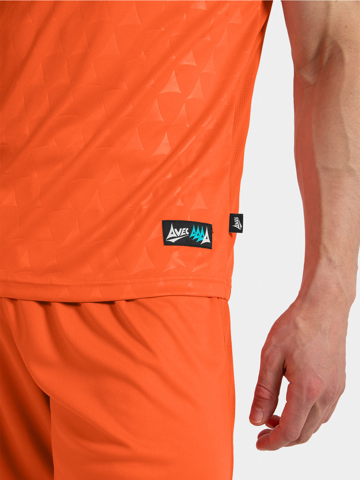 	side-seam view of the orange heritage jersey showcasing breathable ultra-mesh fabric.