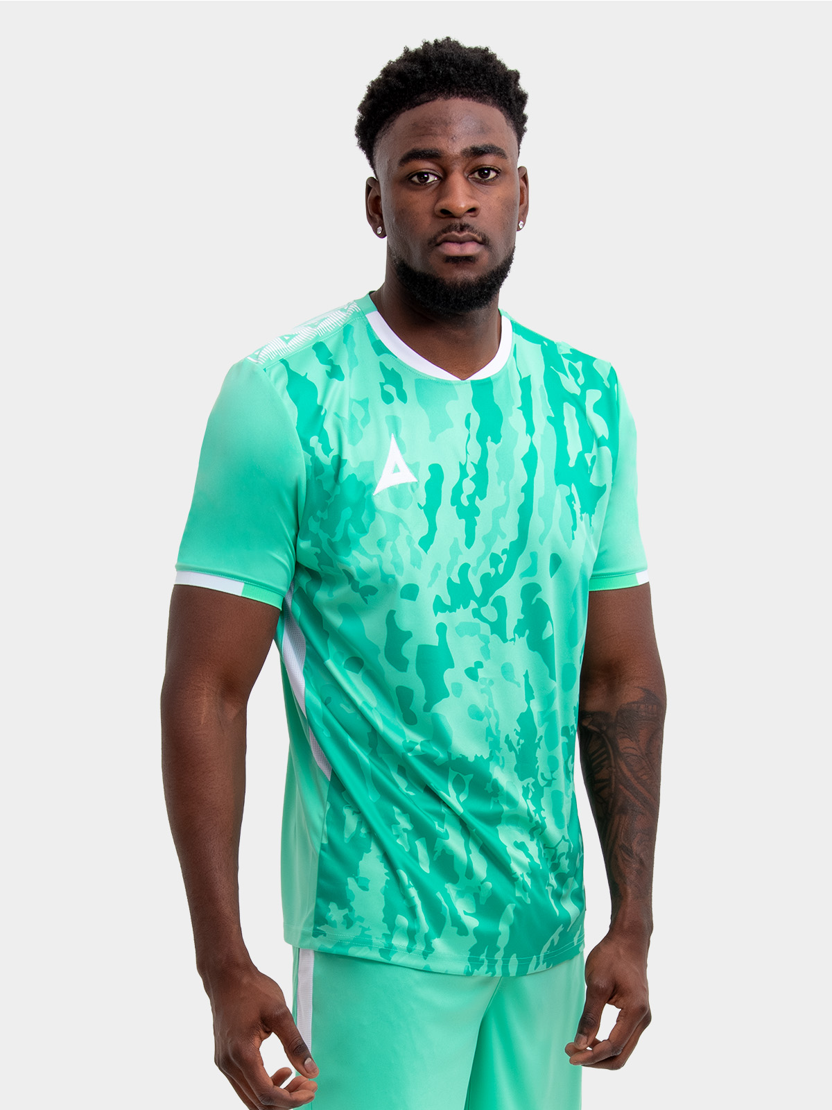 model wearing a mint green / hyper green sports football training t-shirt.