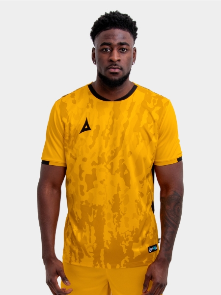 	Model wearing an amber and Black Sports football training t-shirt.