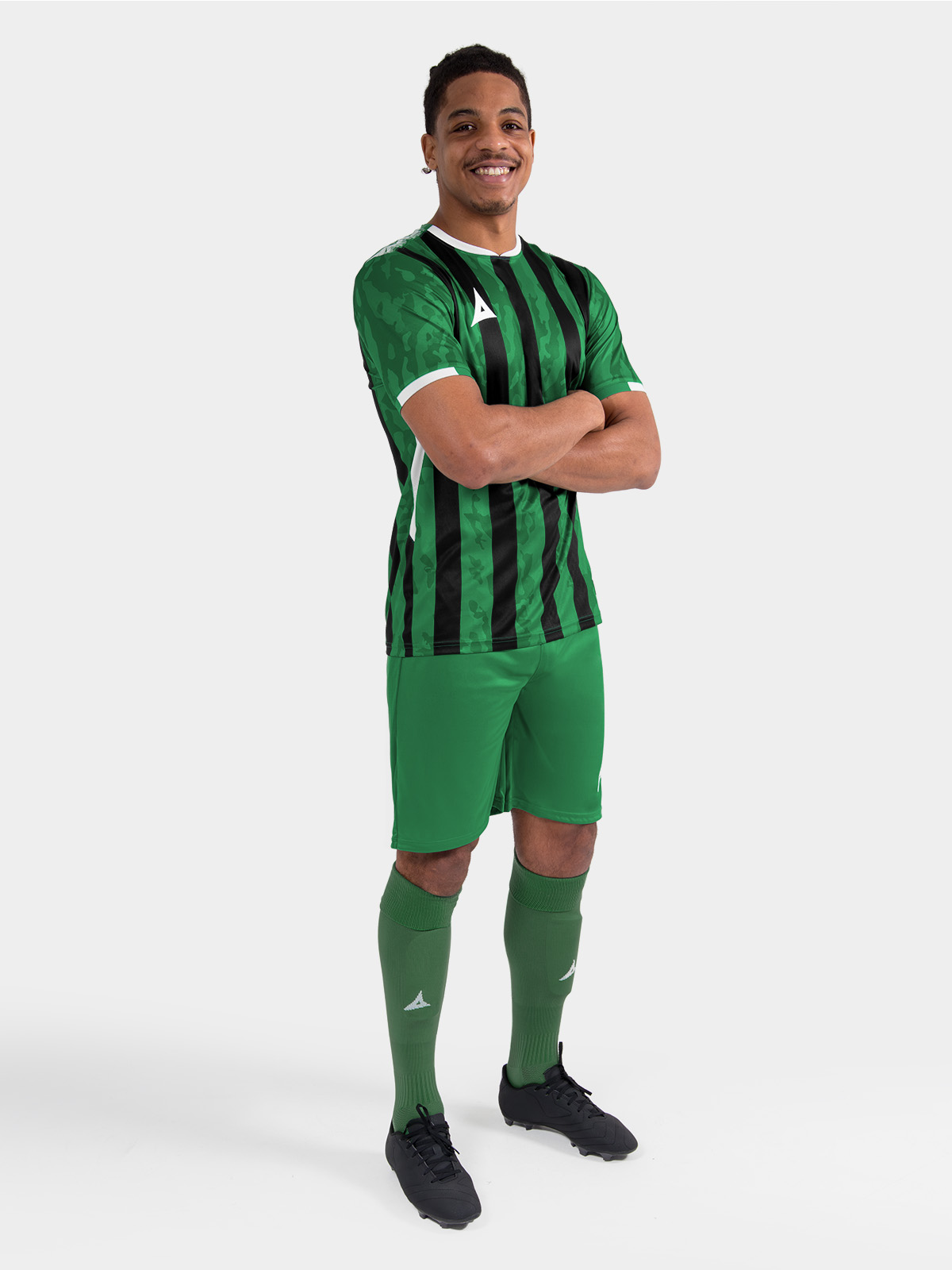  	full matchday view of a player in the green and black pro intent stripe kit, delivering a premium look for grassroots teams.