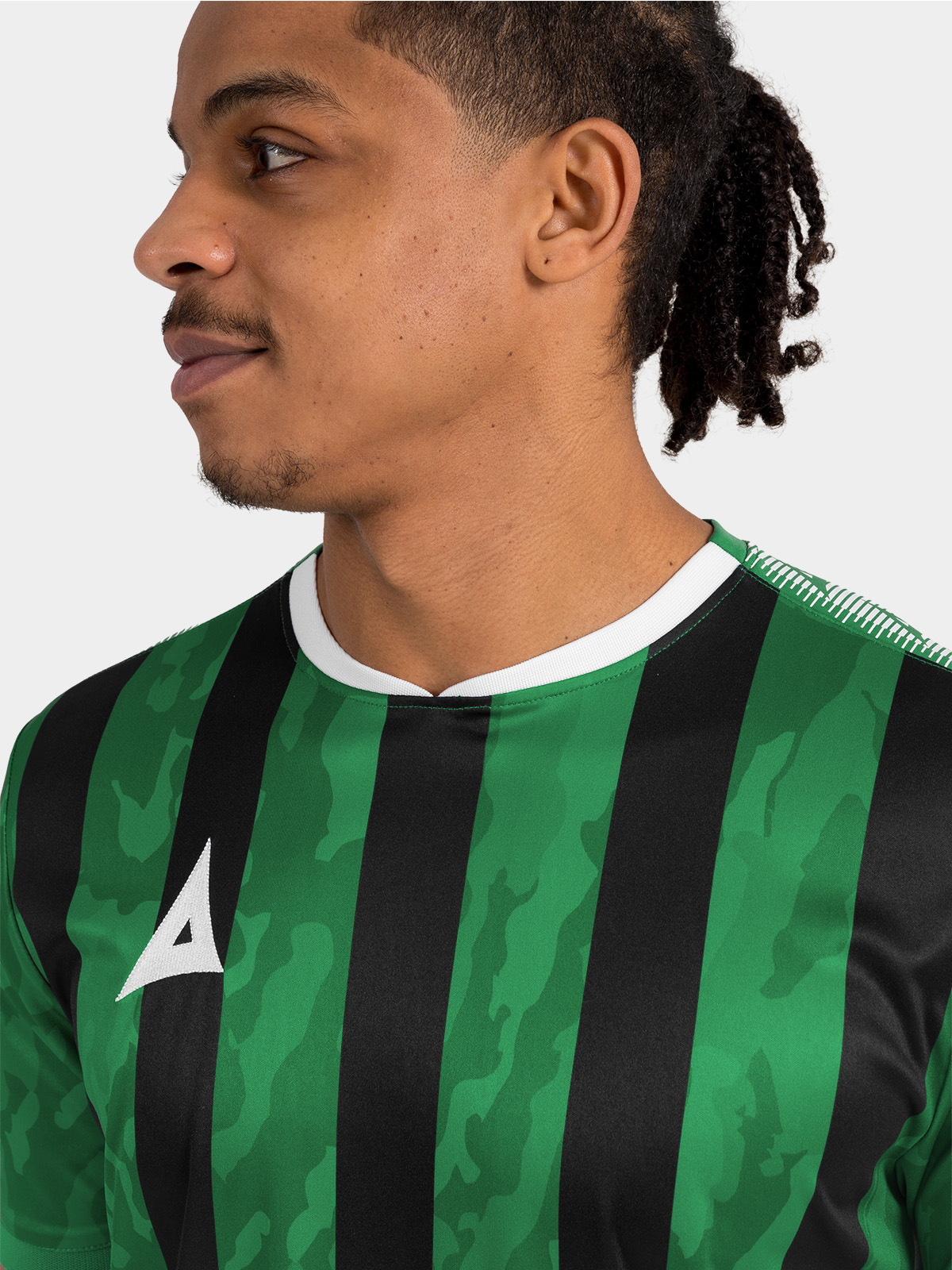 	detailed shot of the embroidered avec logo and sublimated camo detailing on the green and black pro intent jersey.