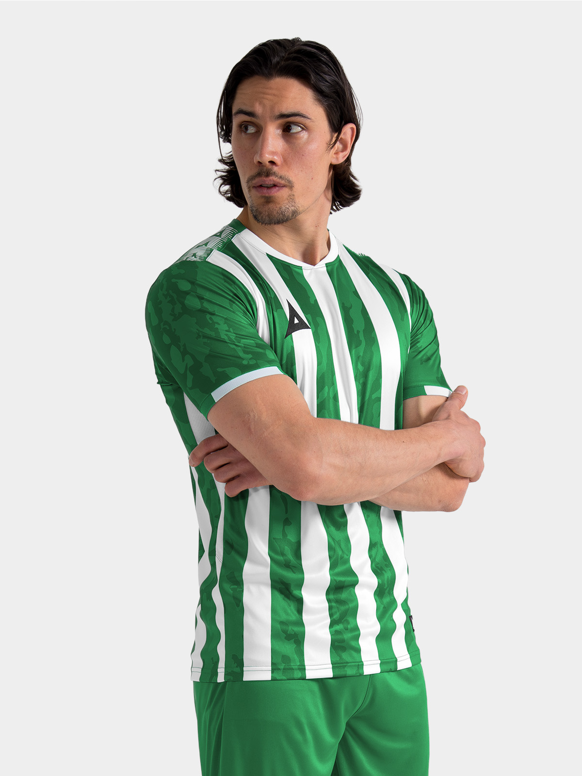 	adult male model wearing the green and white pro intent stripe jersey, showcasing the true-to-size pro fit shaping.