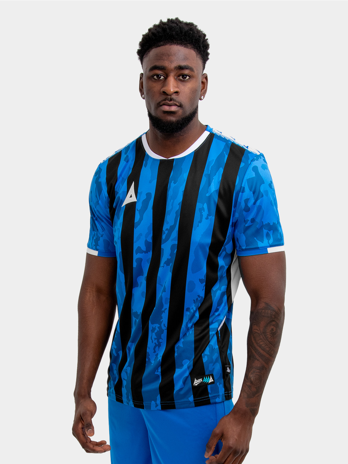 	model wearing a royal blue and black stripe sports football training t-shirt.