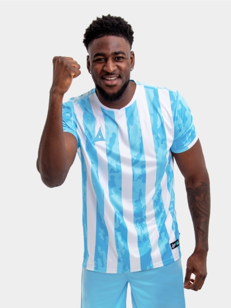 	An adult is wearing a Sky Blue and White stripe shirt, which resembles the likes of the Argentina National team. There is a camo pattern within the sky blue elements