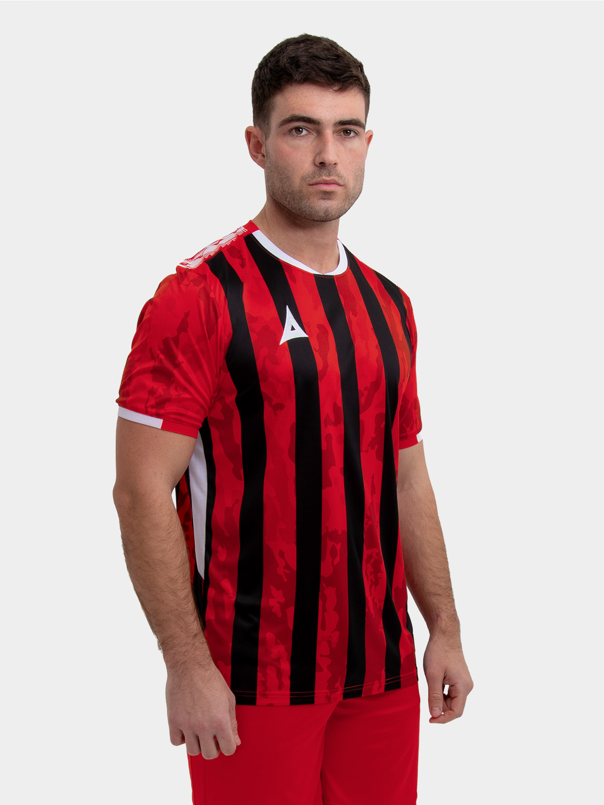 	model wearing a red and black stripe sports football training t-shirt.