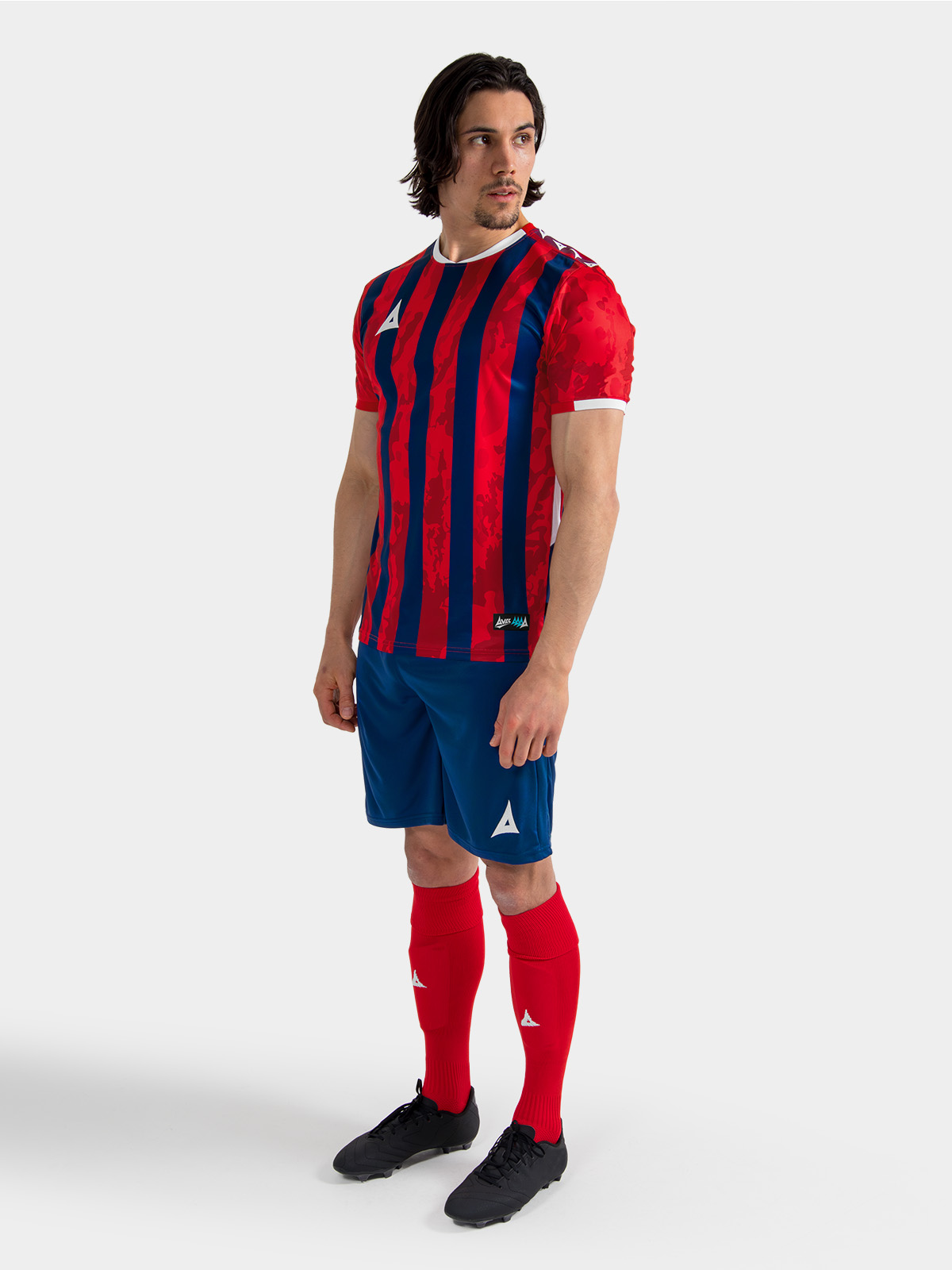 	full-body matchday look of the red and navy striped teamwear jersey, delivering a premium aesthetic for amateur teams.