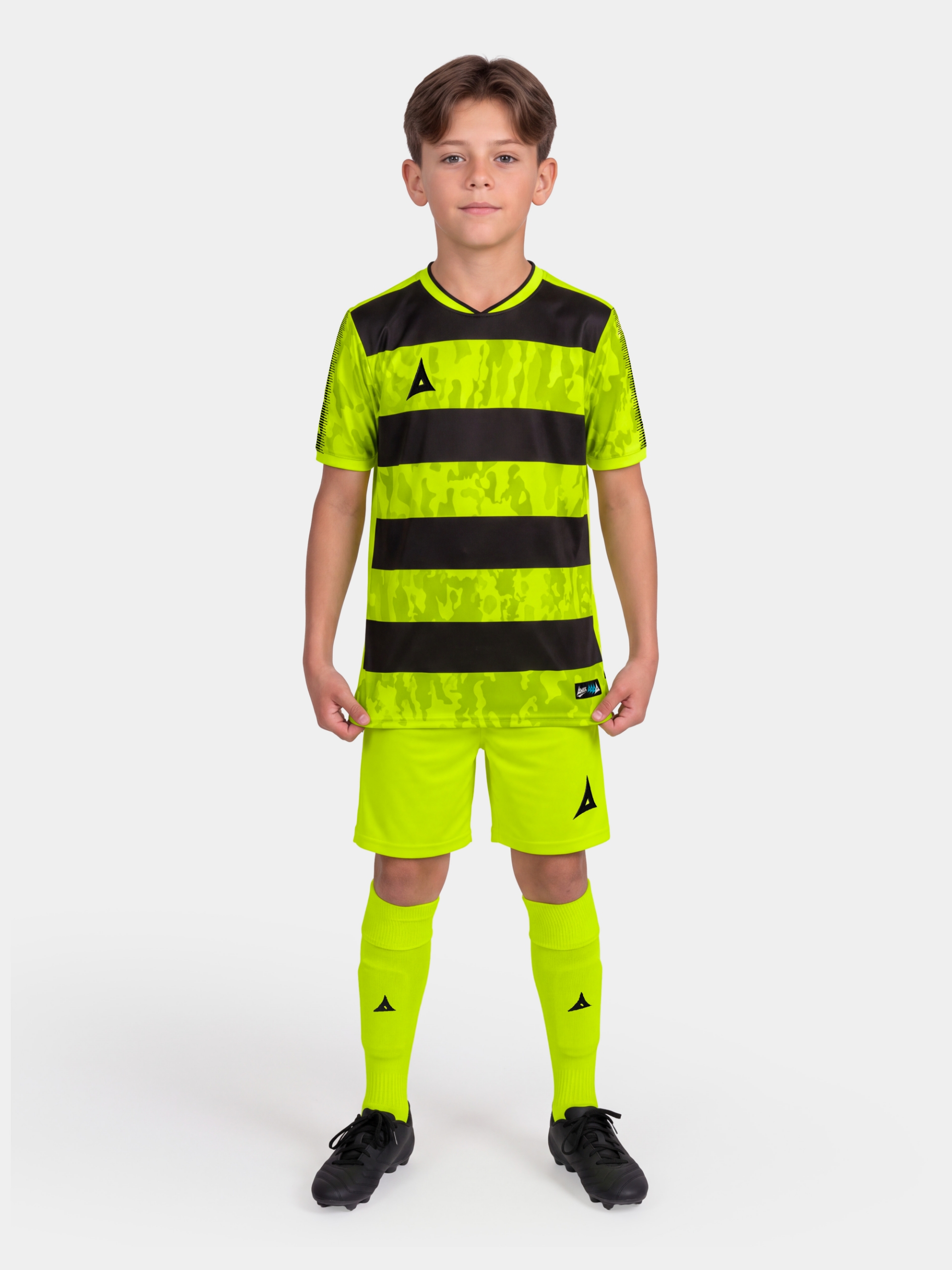 	full body shot of the neon yellow and black pro intent kit, showing the high-visibility uniform on-model.