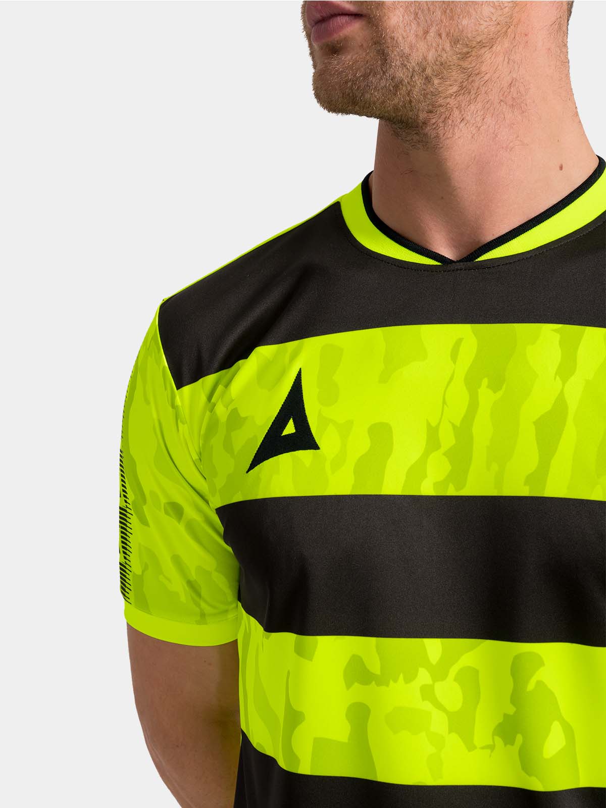 	close-up of the neon yellow v-neck collar and comfortable internal neck branding.