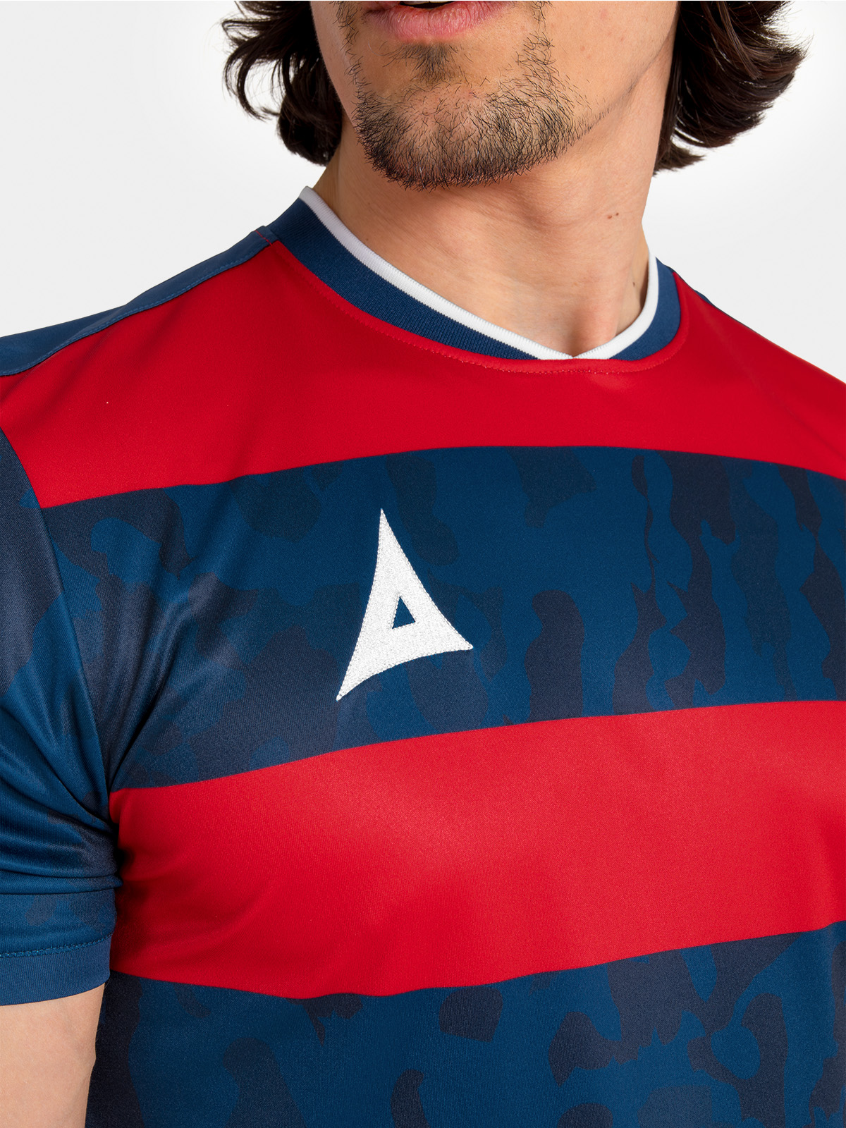 	technical shot of the navy and red collar and neck label, designed for comfort during high-intensity play.