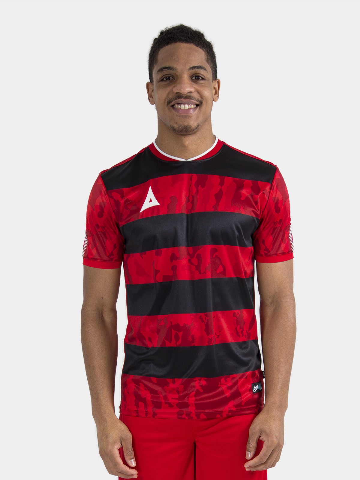 	upper body view of a model wearing the red and black pro intent jersey, showcasing the true-to-size athletic cut.	